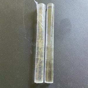 Clay rolling pin. One used the other in the wrapper.